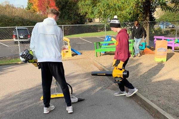 Westside Christian Students helping with landscape maintenance at a school